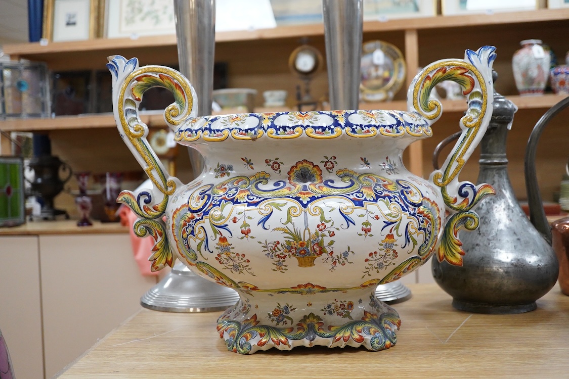 A large ornate two handled French faience planter, 39cm high
